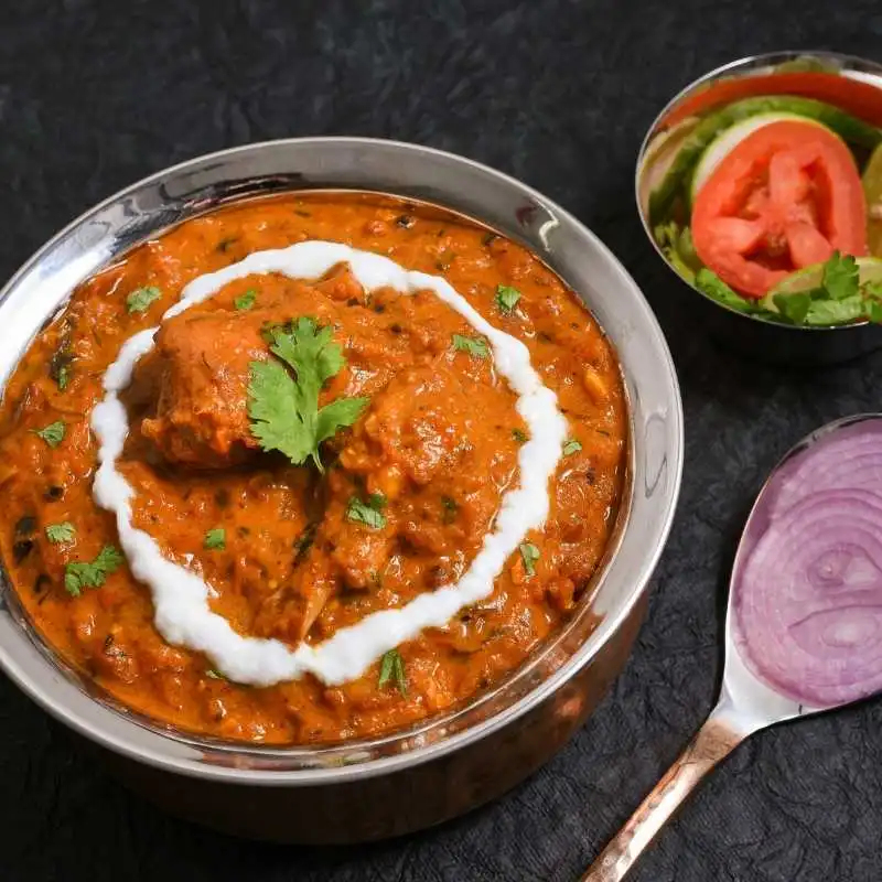 Butter Chicken - Creamy tomato-based curry at New Mountain Village Edmonton Indian restaurant