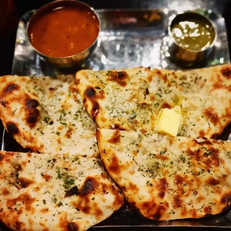 Butter Chicken - Signature creamy curry and most popular dish at New Mountain Village Edmonton